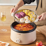 Person using a thermos with food inside on a wooden table.