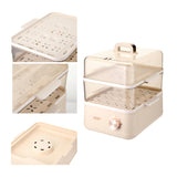 Multifunctional kitchen steamer with different components on a white background