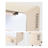 Beige toaster oven with a white background