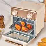 Beige toaster oven with chicken wings inside on a kitchen counter.