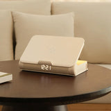 Book-shaped lamp speaker with wireless charging feature on desk