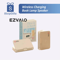 Book-shaped lamp speaker with wireless charging feature on desk