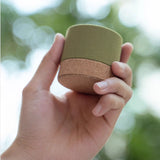 a hand hold Eco Cork Bluetooth Speaker