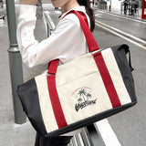 Expandable Wet-Dry Separation Travel Tote in purple and navy with palm tree logo and bottom shoe compartment_ corporate gifts