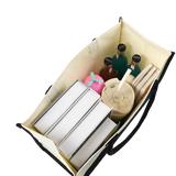 Open tote bag with bottles, cups, and straws on a white background