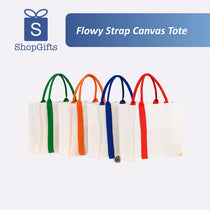 Four canvas tote bags with colorful straps on a white background, branded as ShopGifts.
