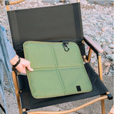 Olive green waterproof folding outdoor seat cushion with black carabiner clip for hiking and camping_customised corporate gifts singapore