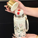 Mini sport vacuum bottle with integrated cup and Van Gogh design, perfect for elegant and functional corporate gifts.