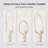 Sleek stainless steel vacuum tumbler with an elegant camellia flower design.