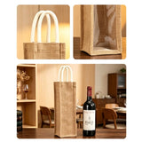 Natural Artisan Jute Wine Carrier with clear window and white rope handles on a wooden surface_Corporate Door Gift