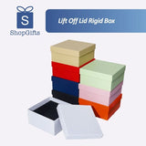 A colorful stack of premium Lift Off Lid Rigid Boxes in various shades including navy, red, orange, pink, and black, featuring a sturdy two-piece telescopic design for high-end gift packaging. corporate gift singapore