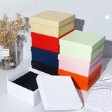 A colorful stack of premium Lift Off Lid Rigid Boxes in various shades including navy, red, orange, pink, and black, featuring a sturdy two-piece telescopic design for high-end gift packaging. corporate gift singapore