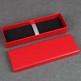 Red textured linen pen gift box with black velvet interior and elastic security strap_ corporate gift supplier singapore
