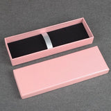 pink textured linen pen gift box with black velvet interior and elastic security strap_ corporate gift supplier singapore