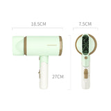 Green hair dryer with measurements on a white background