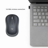 A user operating a black and gray Logitech M185 wireless mouse on a wooden desk next to a laptop with a plugged-in USB nano receiver_customised Corporate gift Singapore