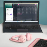 Logitech Zone 300 Bluetooth headset resting next to a laptop and a smartphone on a clean office desk, highlighting its dual-device multipoint connectivity_custom premium corporate gifts singapore