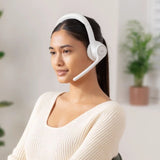 Logitech Zone 300 Bluetooth headset resting next to a laptop and a smartphone on a clean office desk, highlighting its dual-device multipoint connectivity_custom premium corporate gifts singapore