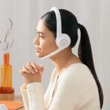 Logitech Zone 300 Bluetooth headset resting next to a laptop and a smartphone on a clean office desk, highlighting its dual-device multipoint connectivity_custom premium corporate gifts singapore