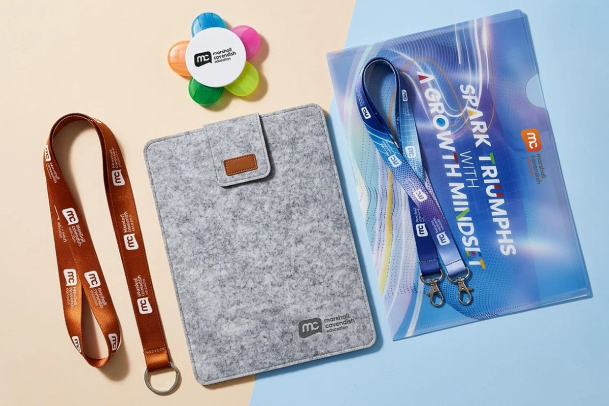 Gray case, lanyard, and promotional material on a beige and blue gradient background