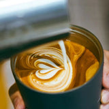 MONTIGOSenseCoffeeCupRegular with matte finish and black lid on a wooden desk_corporate gifts