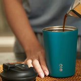 MONTIGOSenseCoffeeCupRegular with matte finish and black lid on a wooden desk_corporate gifts
