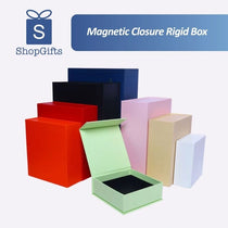 A collection of premium Magnetic Closure Rigid Boxes in various sizes and colors, including black, red, navy, pink, and lime green, featuring a seamless flip-top lid with a concealed magnetic seal. corporate gift