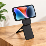 Magnetic MagSafe Phone Stand in black with textured finish, folding support and card slot on a white background