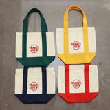 Cream and navy blue Artisan Contrast Trim Canvas Mini Tote with front pocket  Gift shop