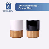 Minimalist black and white ceramic mugs with natural bamboo bases_ corporate gift