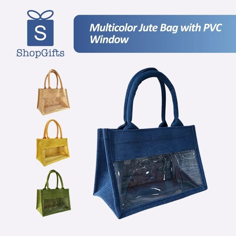 Natural jute tote bag with a clear PVC display window and padded handles on a grassy background_corporate jute bag_corporate door gift