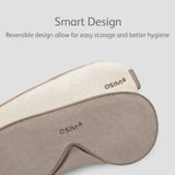 Sleep mask with reversible design on a light gray background, featuring the Osim logo.