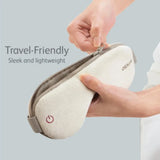 Hand holding an uMask with 'Travel-Friendly' and 'Sleek and lightweight' text on a gray background.