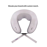 ShopGifts - Ergonomic neck massage pillow providing deep tissue relief on a couch