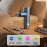 Metallic Blue Elite Ultra-Portable Percussion Massager with four interchangeable heads on a wooden surface_Premium door gift_corporate gift