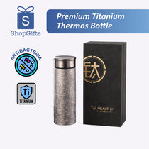 Premium Titanium Thermos Bottle with packaging and branding elements on a white background