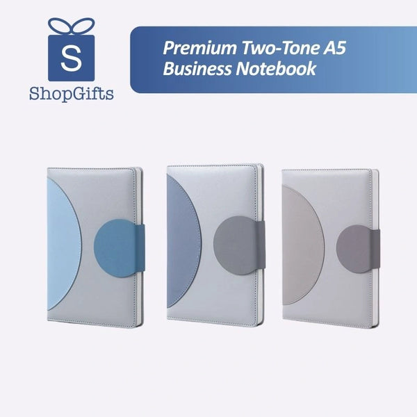 Three Minimalist Two-Tone Premium Business Journals in blue and grey shades with circular magnetic clasps_ corporate gift