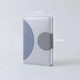 Three Minimalist Two-Tone Premium Business Journals in blue and grey shades with circular magnetic clasps_ corporate gift