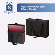 Premium matte black Rigid Drawer Boxes featuring a smooth slide-out mechanism, a small ribbon pull-tab, and matching black satin ribbon handles for luxury gift presentation. corporate gift supplier