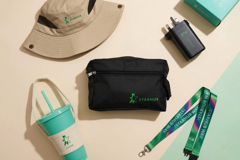 Collection of travel accessories with Starmhub branding on a beige surface.