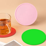 Minimalist food-grade silicone anti-slip coaster with raised edge for heat protection and spill containment_ corporate gift