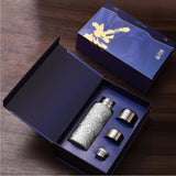  Titanium Magnetic Infusion Mug set with two cups in a blue gift box on a wooden surface