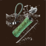 Green water bottle with accessories on a dark background