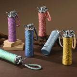 Colorful glittery lighters with keychains on a brown surface