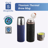 Titanium Thermal Brew Mug with blue and black designs, featuring ShopGifts logo and antibacteria titanium symbols.