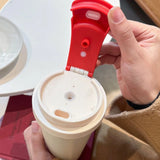 Matte black and cream Triple-Mode 316 Stainless Steel Tumblers with dual-drinking lids on a white background