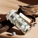 Elegant Van Gogh-inspired vacuum tumbler in pure titanium, designed for upscale corporate gifting.
