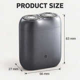 Xiaomi Pocket Electric Travel Shaver (S200) in grey with dual circular shaving foils on a wooden travel desk