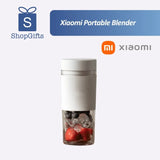 Xiaomi 300ml Portable Blender  with a transparent cup and silicone sleeve for smoothies.