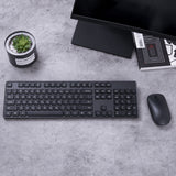 Xiaomi Wireless Keyboard Mouse Combo (WXJS01YM) in black on a tidy office desk.